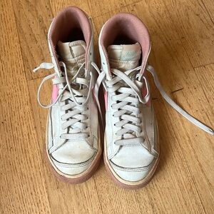 Pink high top Nike shoes